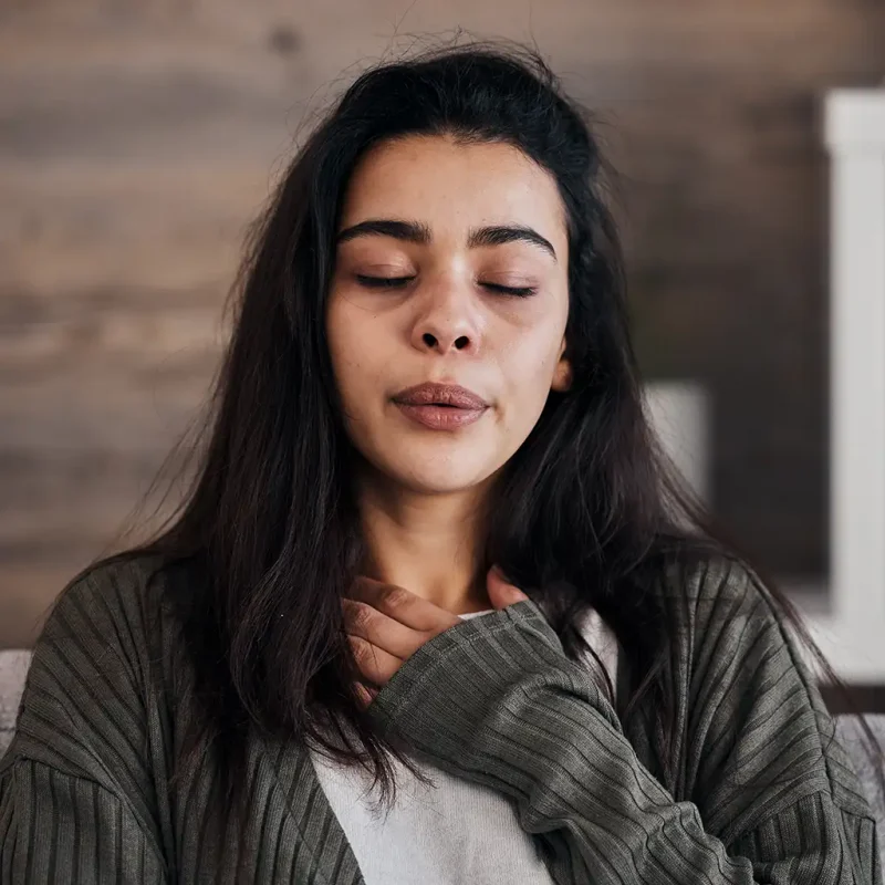 a woman with her eyes closed