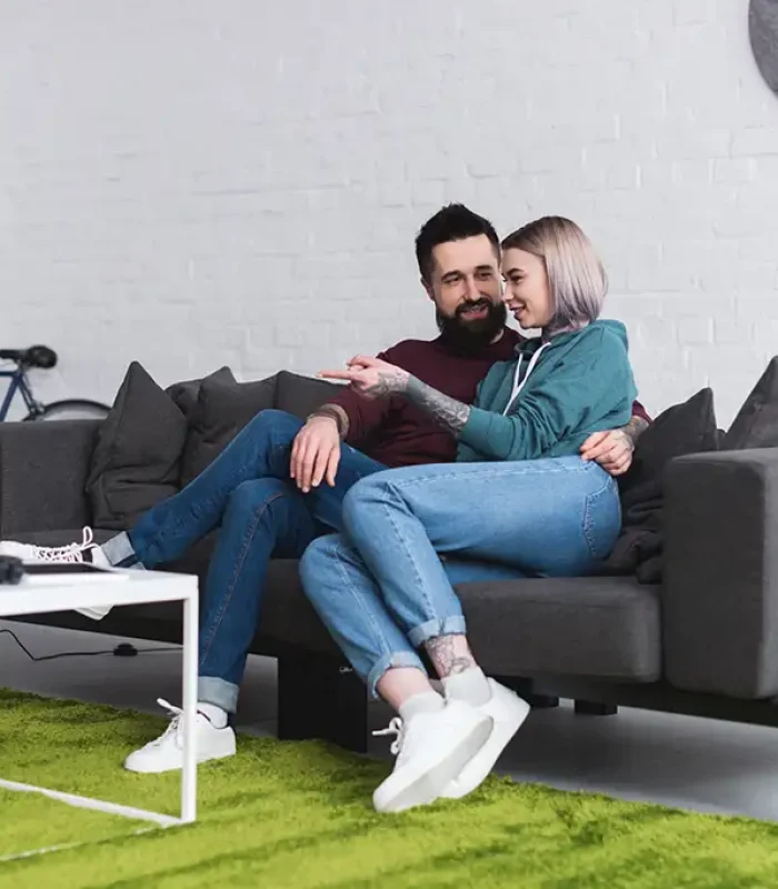 couple-hugging-on-sofa